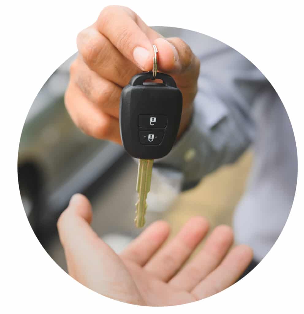 Hand holding car keys